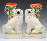 A PAIR 19TH CENT STAFFORDSHIRE POTTERY SPANIELS