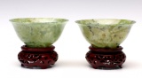 A PAIR OF SMALL SPINACH JADE BOWLS ON STAND