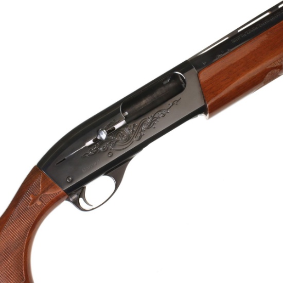 A REMINGTON 3-INCH 12 GAUGE MAGNUM MODEL 1100 SHOTGUN