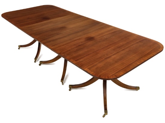 A REGENCY STYLE TRIPLE PEDESTAL MAHOGANY BANQUET TABLE