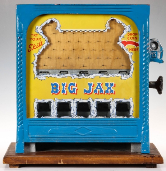 A VINTAGE CAST ALUMINUM AND WOOD NICKEL DROP GAME