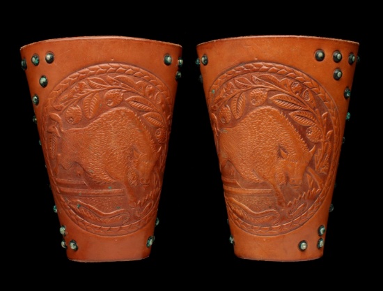 A PAIR TOOLED LEATHER BRACERS WITH BISON SIGNED SHIPLEY