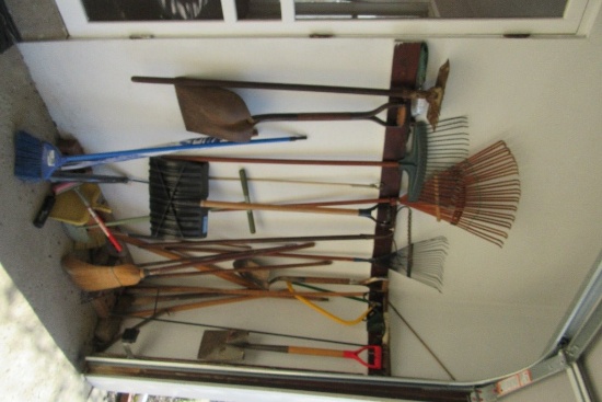 CORNER LOT OF GARDEN TOOLS, SHOVELS, RAKES, BROOMS, AXE, SAW, ETC