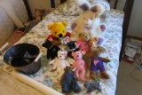 VARIETY OF STUFFED ANIMALS AND METAL BASKET