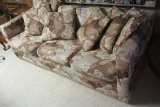 BROWN FLORAL SLEEPER SOFA. VERY HEAVY. THIS ITEM IS IN THE BASEMENT. BRING