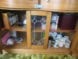 MUGS. VHS TAPES. LIGHTED MIRROR AND ETC IN TWO DRAWERS AND BOTTOM OF CABINE