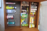 CUPBOARD LOT OF LIGHT BULBS, CLEANING PRODUCTS, AND ETC