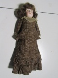 ANTIQUE DOLL WITH LEATHER STUFFED BODY