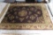47 X 72 JCPENNEY AREA RUG 100% VIRGIN WOOL PILE COLOR BROWN. DAMAGED EDGE
