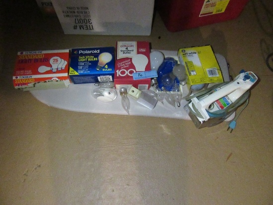 VARIETY OF LIGHT BULBS AND IRON AND PORTABLE IRONING BOARD