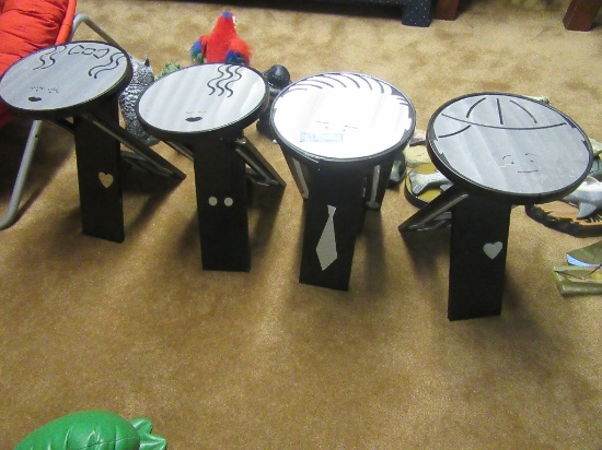 4 COLLAPSIBLE STOOLS WITH FACES ON TOP