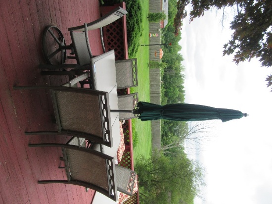 HEAVY METAL UMBRELLA TABLE WITH TILE TOP AND 6 CHAIRS