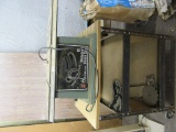 DELTA 10-INCH MOTORIZED BENCH SAW ON BENCH