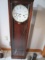HOWARD MILLER WALL CLOCK W/ WESTMINSTER CHIME. APPROX. 4' TALL. WEIGHTS MISSING.