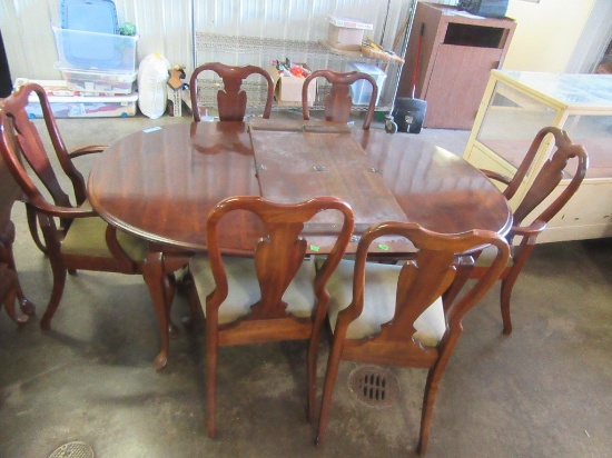 DINING ROOM TABLE WITH 6 CHAIRS AND ONE LEAF. HOST CHAIR HAS BEEN REPAIRED