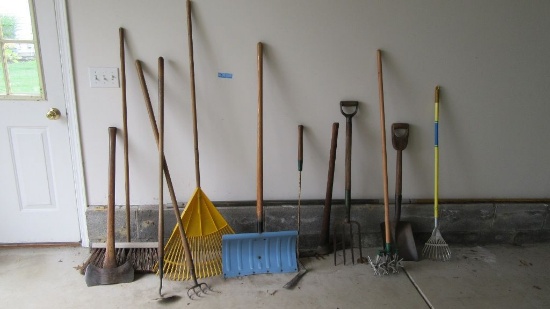 ASSORTED LAWN AND GARDEN TOOLS INCLUDING AXES, PICK, SHOVELS, RAKES, AND ET