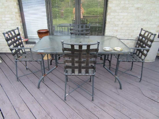 PATIO SET GLASS TOP TABLE APPROXIMATELY 4 FT BY 3 FOOT & 4 CHAIRS. LITTLE R