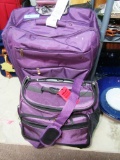 ASSORTED PIECES OF LUGGAGE IN PURPLE