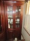 LIGHTED GLASS FRONT CURIO CABINET WITH STORAGE