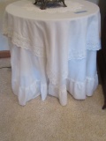 PAIR OF ROUND PARTICLE BOARD TABLES WITH TABLECLOTHS