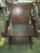 VERY CARVED WOOD CHAIR. FOLDS UP