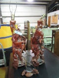 PAIR OF WOODEN ORIENTAL FIGURINE LAMPS. ONE IS CRACKED AND BROKEN
