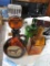 VARIETY OF COLORED DECANTERS AND BOTTLES