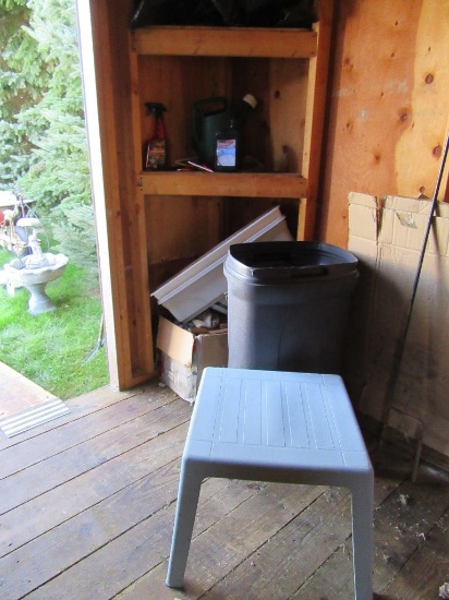 CORNER OF MISCELLANEOUS STUFF INCLUDING PLASTIC TABLE, TRASH CAN, STAKES FO