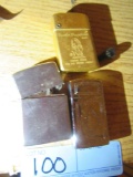 3 LIGHTERS INCLUDING GOLD ONE WITH HUSH PUPPY ON IT.