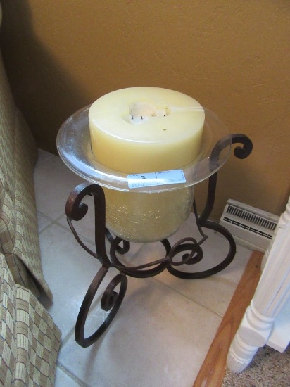 LARGE CANDLE IN GLASS HOLDER ON IRON STAND