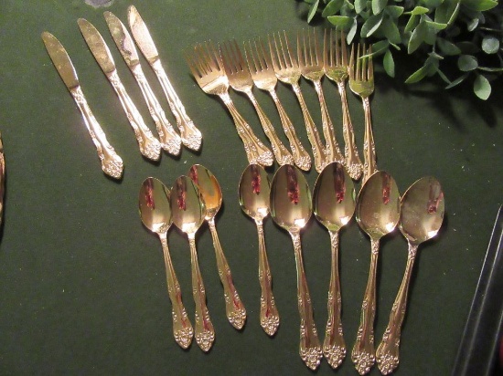 ROGERS STAINLESS GOLD FLATWARE SET. SERVICE FOR 4.