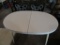 WHITE FORMICA TOP TABLE. WILL NEED ASSEMBLED