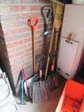 LOT OF SHOVELS AND BROOMS