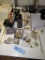 A VARIETY OF COSTUME JEWELRY PINS, NECKLACES, EARRINGS, AND A SILVER AND GO