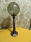 WOOD SPINDLE TINTED GLOBE LAMP