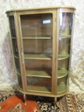 GOLD PAINTED CURVED GLASS CHINA CABINET. GLASS BROKEN IN FRONT PANEL