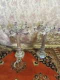 PAIR OF METAL CANDELABRAS. ONE BROKEN CANDLE HOLDER