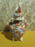 ORIENTAL STYLE VASE. LID HAS A CHIP