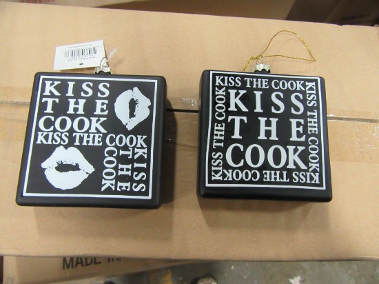 20 CASES OF KISS THE COOK ORNAMENTS 2 ASSORTED. 24 PIECES PER CASE