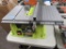 RYOBI 10-INCH TABLE SAW WITH LEGS. MODEL NUMBER RTS10G