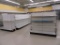 3 ROWS OF LOZIER SECTIONS OF SHELVING WITH 3 END CAPS IN BACK OF STORE