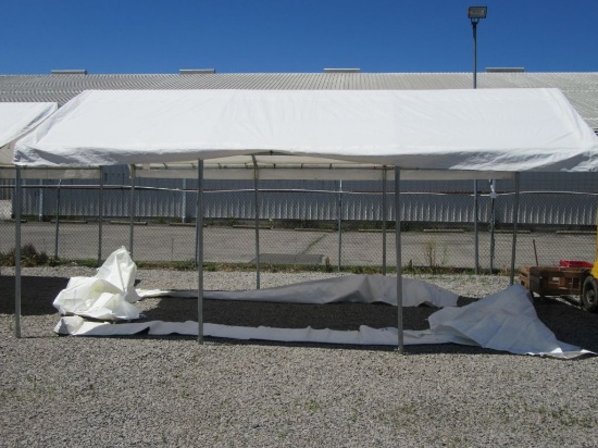 20 FOOT BY 10 FOOT TENT WITH SIDES AND CRATE. NO WHEELS. BUYER WILL HAVE TO