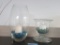 2 CENTERPIECE BOWLS. ONE WITH BLUE GLASS PIECES AND THE OTHER WITH ASSORTMENT OF MARBLES
