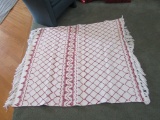 RED AND WHITE QUILT. APPROXIMATELY 4' BY 4-1/2'