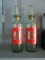 2 GREEN GLASS WITH RED AND GOLD DESIGN DECANTERS