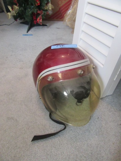 1980'S HELMET WITH PLASTIC REMOVABLE FACE SHIELD. NO NAME OR SIZE.