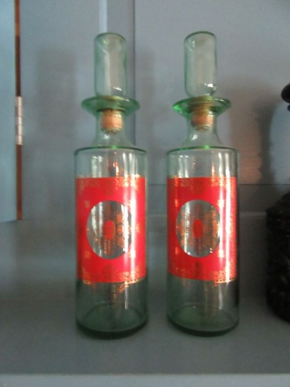 2 GREEN GLASS WITH RED AND GOLD DESIGN DECANTERS
