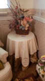 TABLE WITH FLORAL ARRANGEMENT