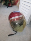 1980'S HELMET WITH PLASTIC REMOVABLE FACE SHIELD. NO NAME OR SIZE.