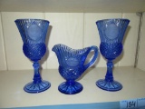 BLUE GLASS STEMWARE AND SMALL PITCHER